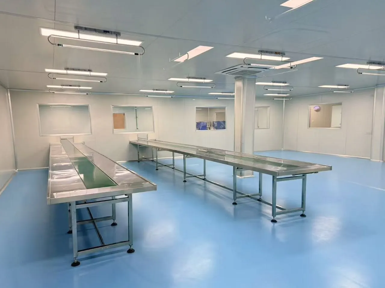 Manual inspection and packing tables inside Sawatdee Group’s factory in Samut Prakan, Thailand.